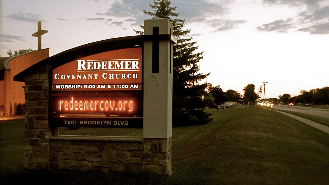 Welcome to Redeemer church sign with cross